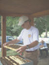 08 Alamance Farm Hertiage Day - Rick Dailey in bee cage -10.jpg (82364 bytes)