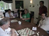 Foregrd Richard White (white) and Fred Follis (red), background Steve Catanese observes Steve Kelly playing red against Joe Margolin (on the right - 10D1 (2).jpg (142112 bytes)